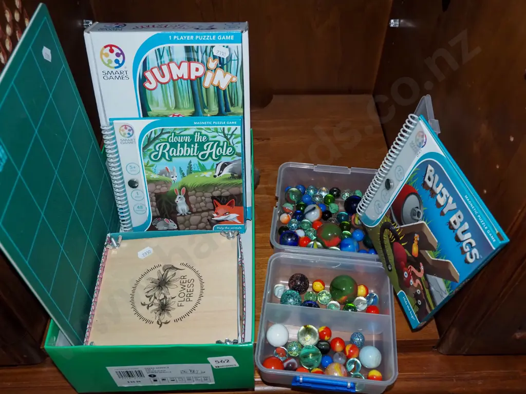shelf; marbles, flower press, Smart Games puzzles, cutting mat Image 1++