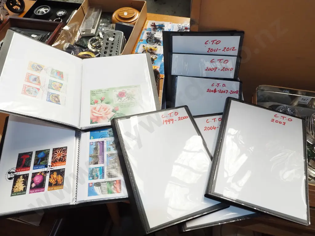 box; various stamps in plastic folders Image 1++