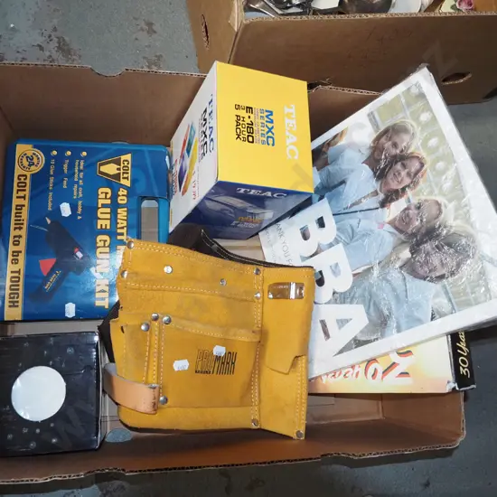 box; builders belt, ABBA DVD and book, glue gun etc