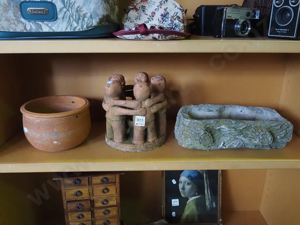 concrete garden log planter, hanging terracotta jardiniere, terracotta ornament - people standing around bowl Image 1++