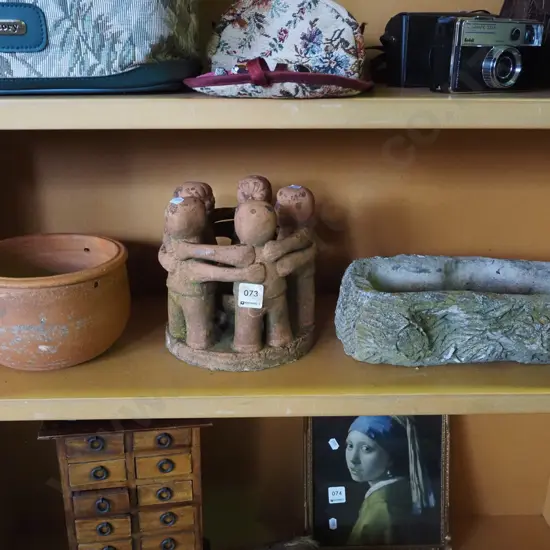 concrete garden log planter, hanging terracotta jardiniere, terracotta ornament - people standing around bowl