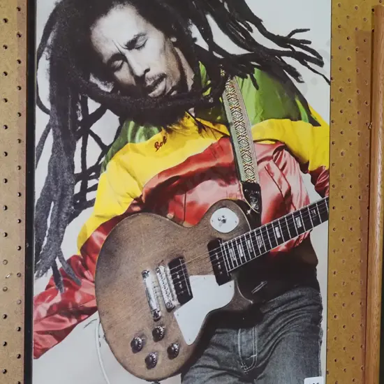framed Bob Marley print on board