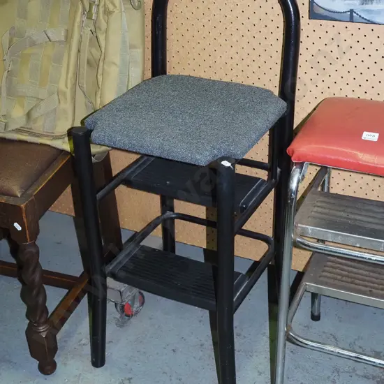 black metal and charcoal upholstered kitchen step stool