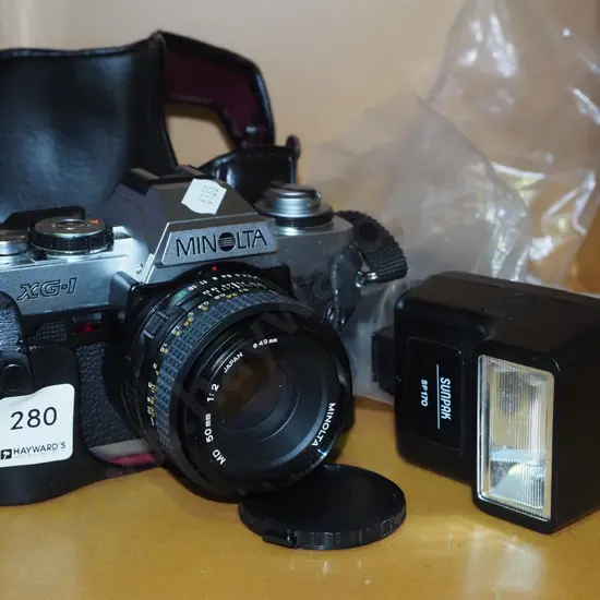 Minolta XG-1 35mm camera with flash