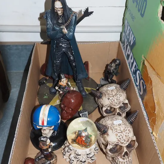 box; composite skulls, death metal figurine, wizard snow globe etc