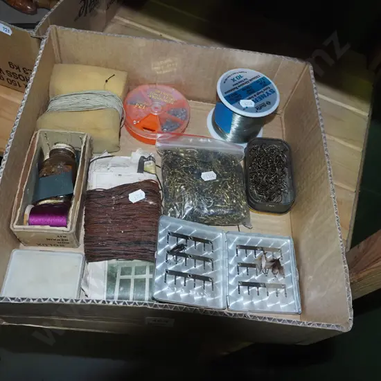 box; fly tieing lines, swivels, hooks etc