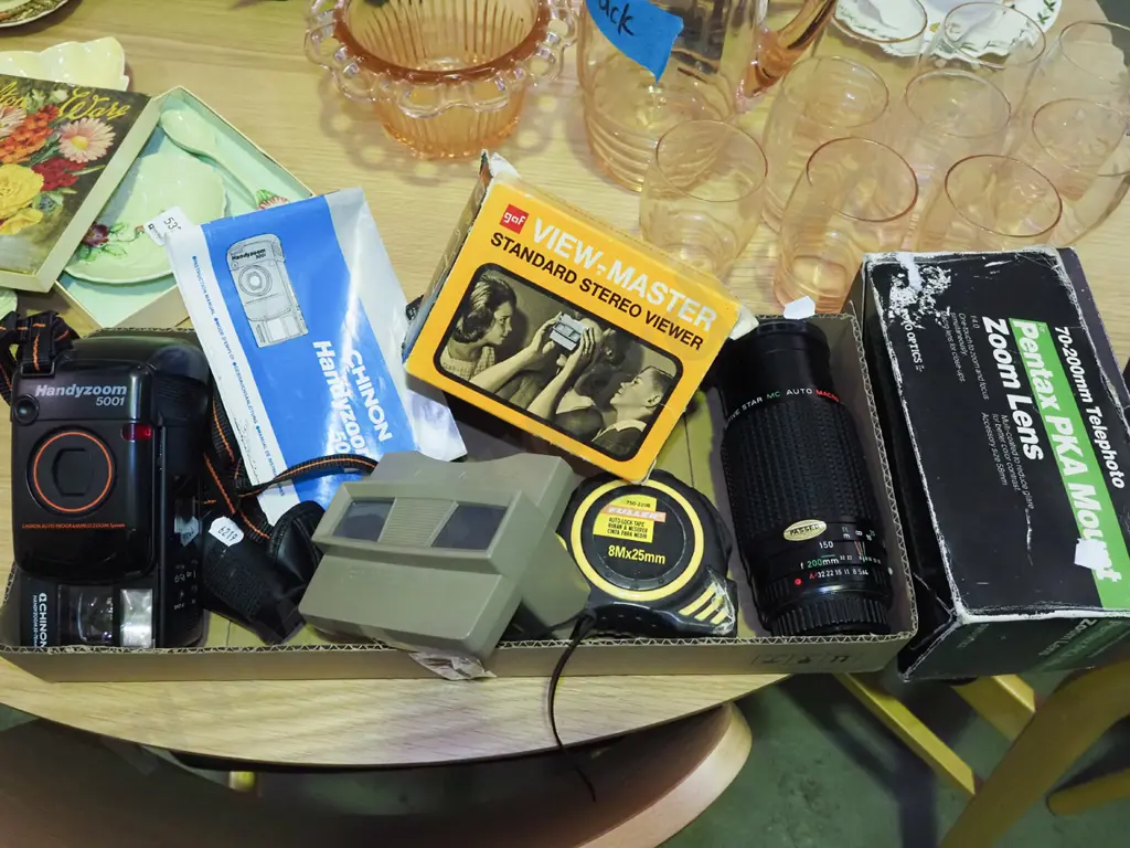 box; Chinon 35mm camera, viewmaster, Pentax zoom lens, tape measure Image 1++