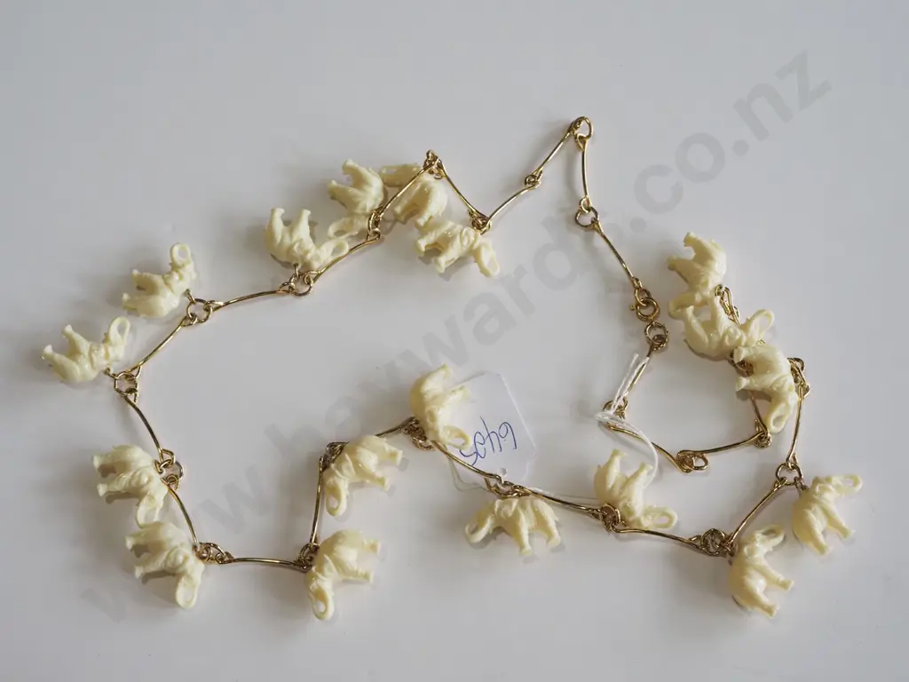 necklace, plastic elephants on chain Image 1++