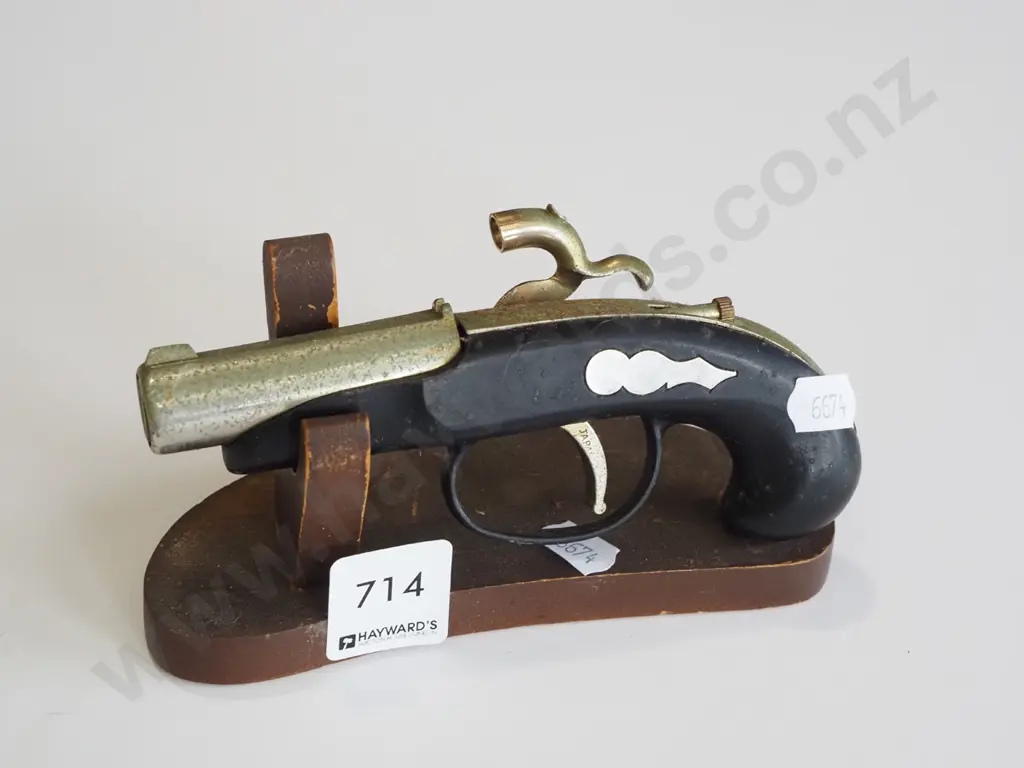 reproduction black powder pistol on stand Image 1++
