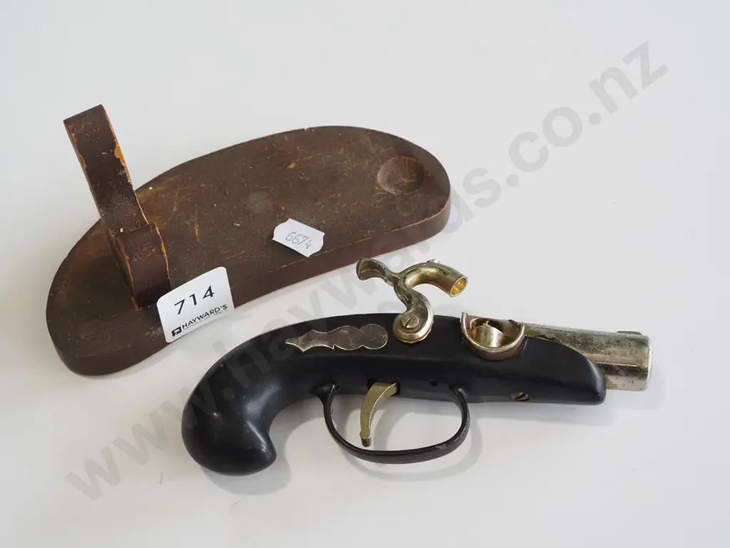 reproduction black powder pistol on stand Image 1++