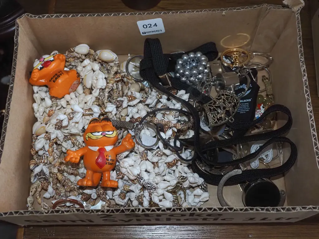 box; whistle, Garfield key rings, shell necklaces etc Image 1++