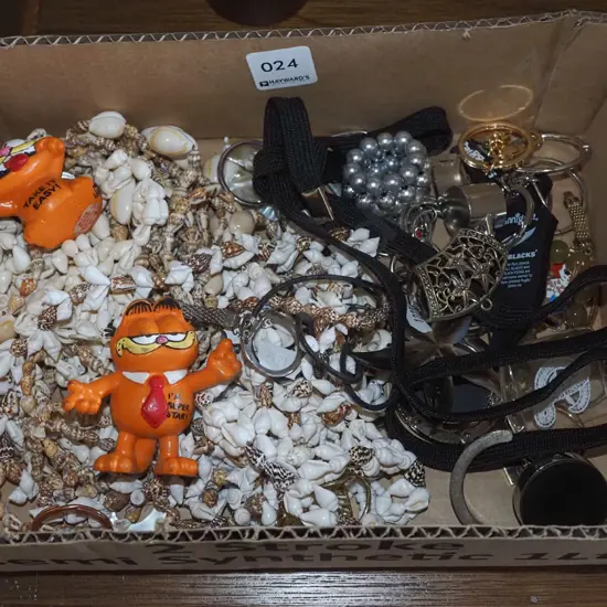 box; whistle, Garfield key rings, shell necklaces etc