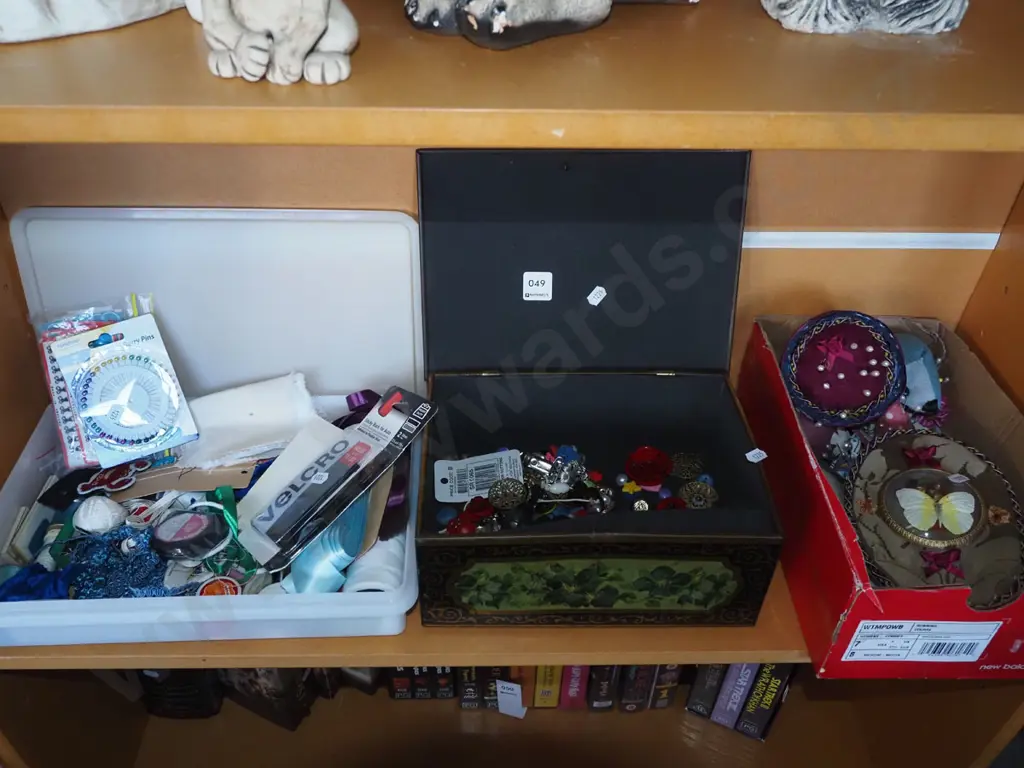 shelf; container of sewing supplies, buttons, pin cushions, pins Image 1++