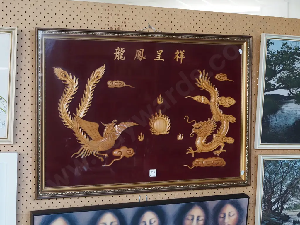 carved Asian phoenix and dragon scene behind glass Image 1++