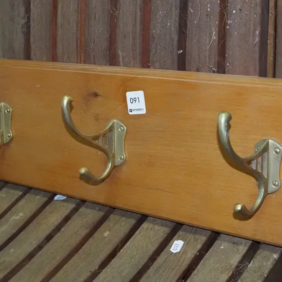 3x brass coat hooks on board