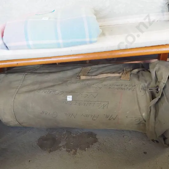 large vintage sail  - possibly a jib - in storage bag