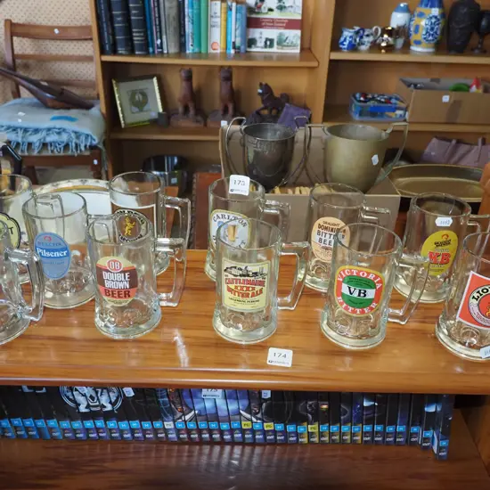 assorted branded beer mugs