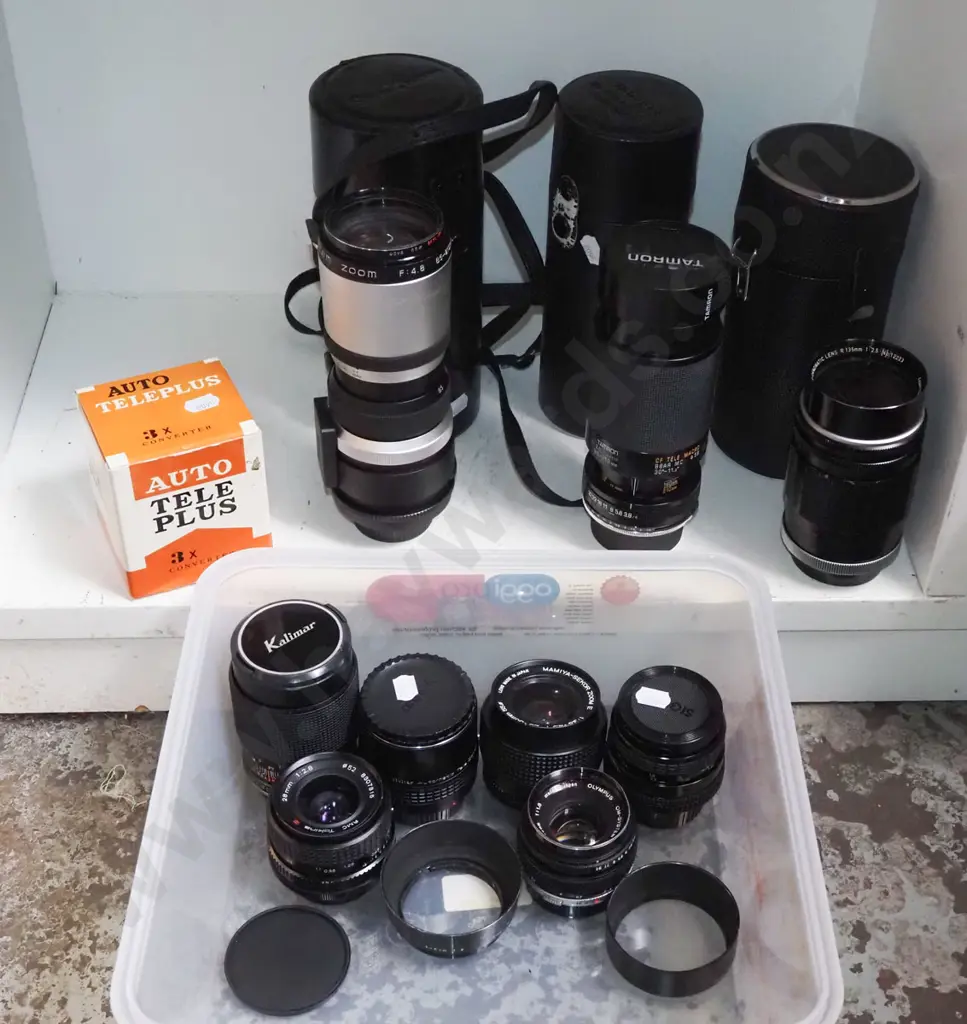 shelf of various camera lenses Image 1++