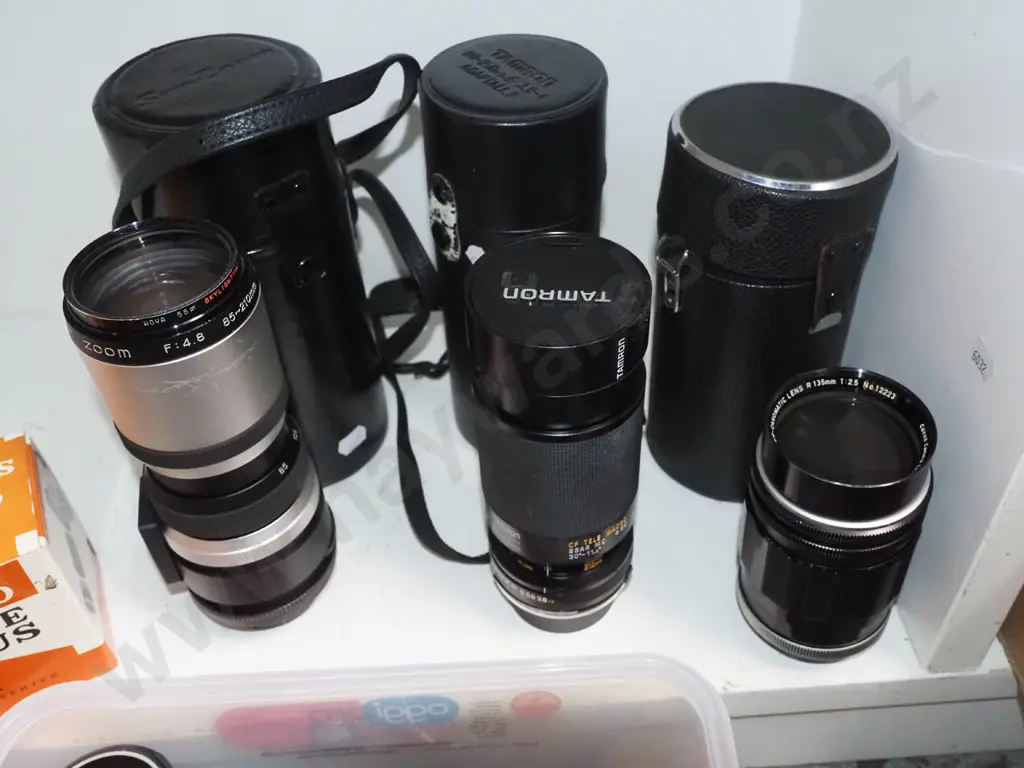 shelf of various camera lenses Image 1++