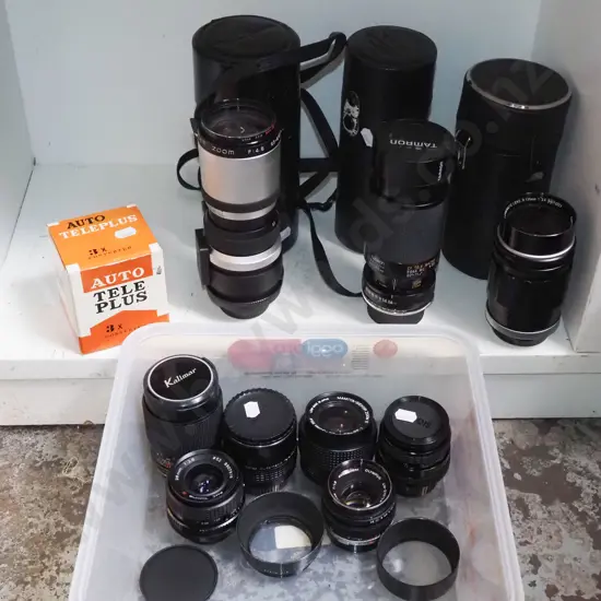 shelf of various camera lenses