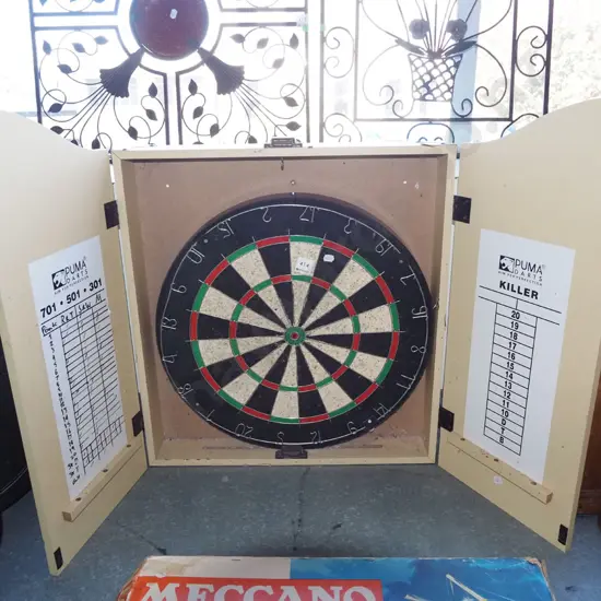 dart board in cupboard