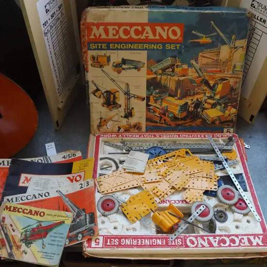 battered Meccano set and instruction manuals