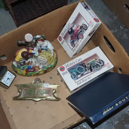 box; figurines, yet to be assembled car models, letter slot etc