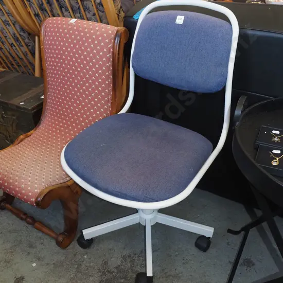 metal and blue upholstered office chair