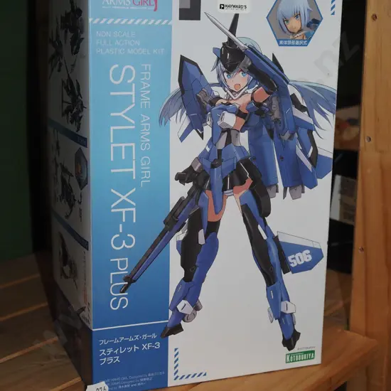 yet to be assembled models of a Japanese anime charcter