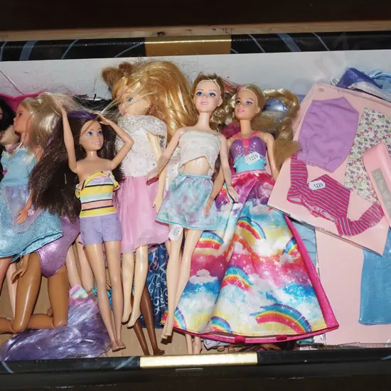 box of Barbie and other dolls