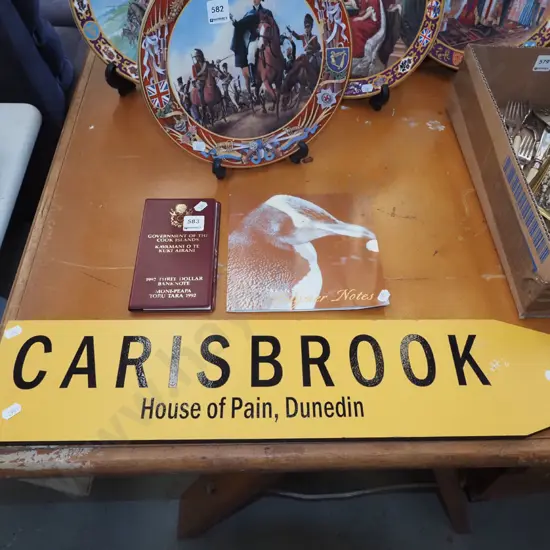 Cook Islands currency, $5 NZ notes, Carisbrook roadside sign