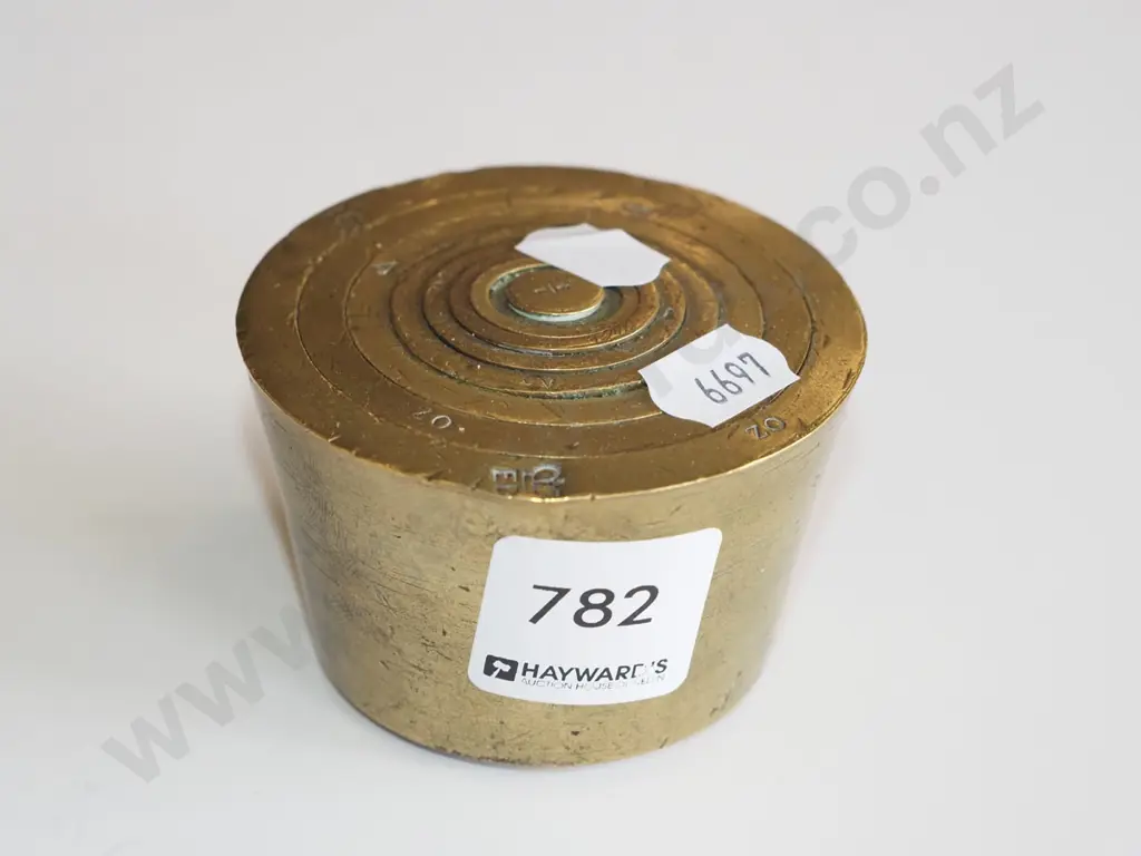 stack of brass nesting weights Image 1++