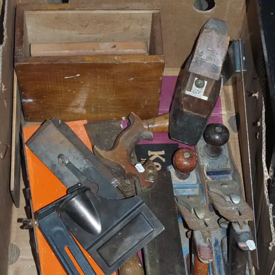 box; rusty hand planes, builder's square, saw etc