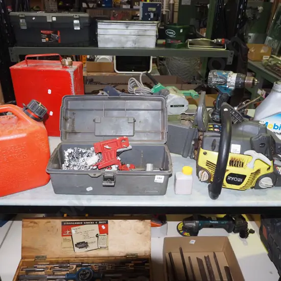 Ryobi chainsaw with accessories; tool box, fuel container, chain bar oil etc