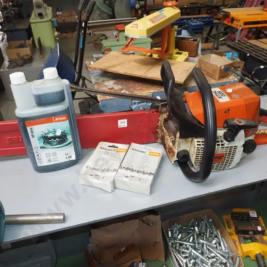 Stihl 025 chainsaw with additional chains and 2 stroke oil