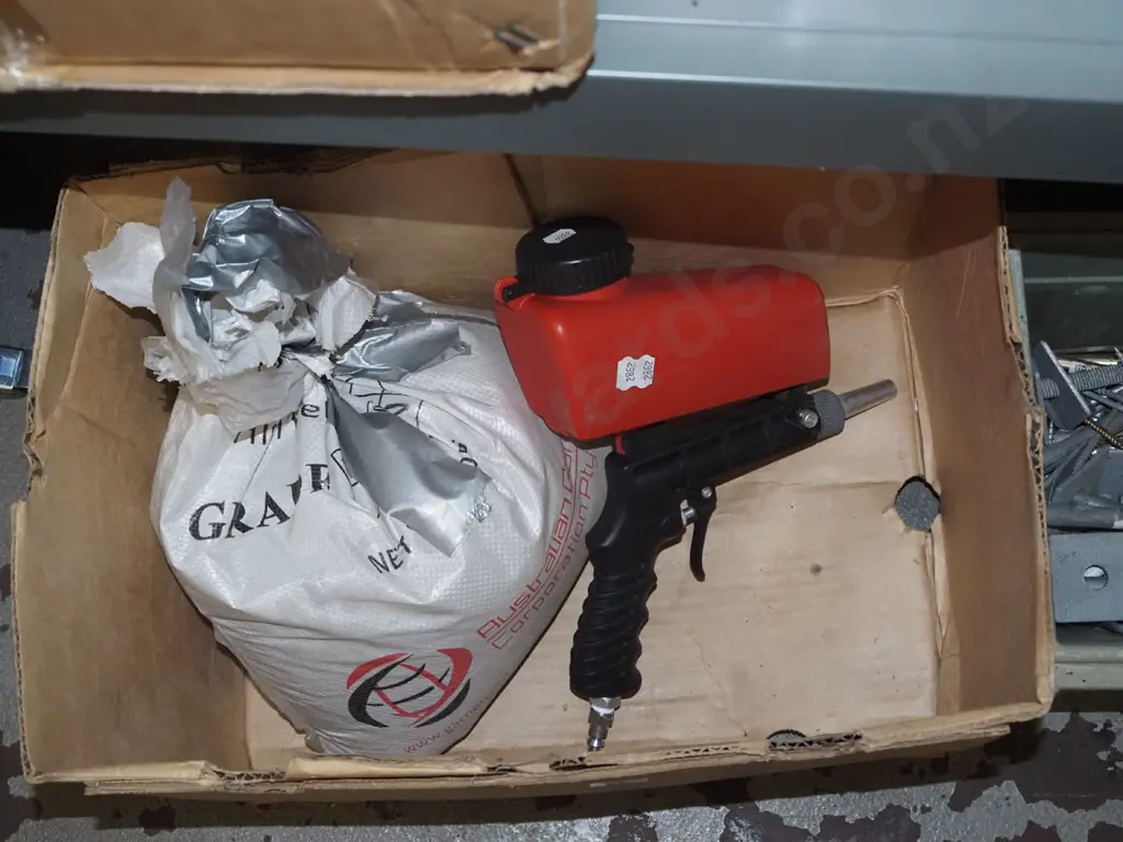 sand blasting gun, bag of aggregate Image 1++