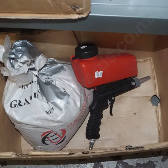 sand blasting gun, bag of aggregate