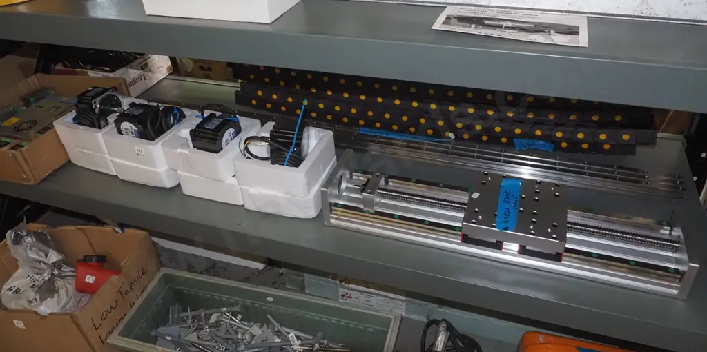 shelf of as new parts to make a CNC machine (Computer Numerical Control)- motors, controllers, tracks, cables etc Image 1++