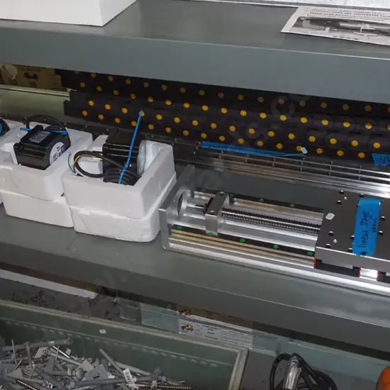 shelf of as new parts to make a CNC machine (Computer Numerical Control)- motors, controllers, tracks, cables etc