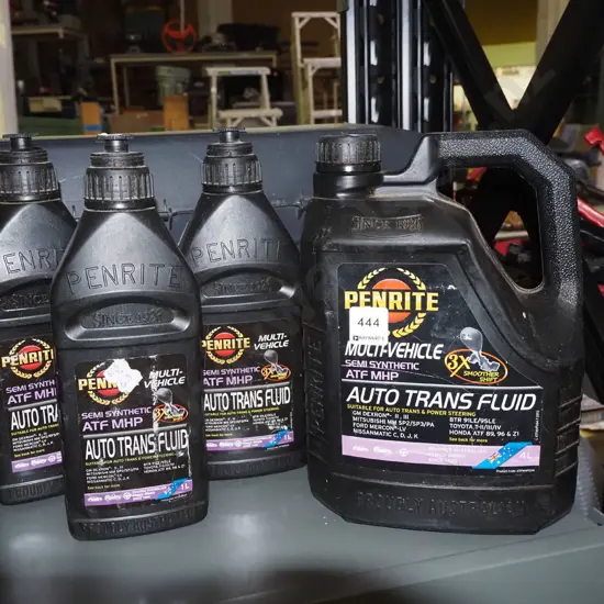 4x containers of transmission fluid