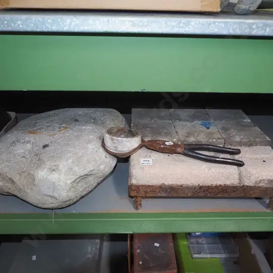 jeweller's crucible, large piece of pumice, heat resistance bricks on metal stand