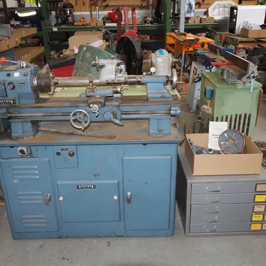 Boxford metal workers lathe with accessories and parts - on top of metal plan drawers