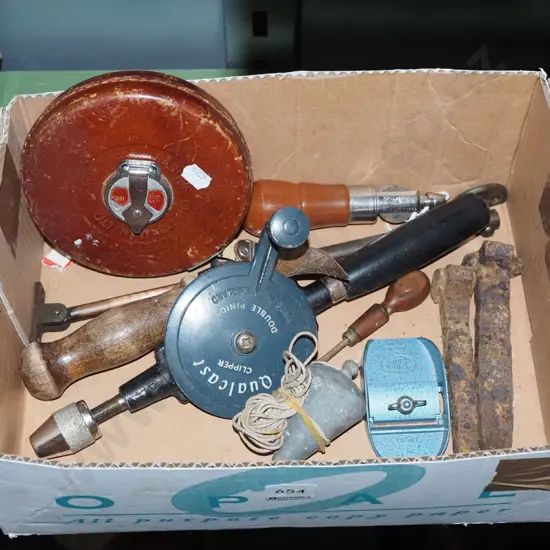 box; egg beater drill, builder's tape, plumb bob etc