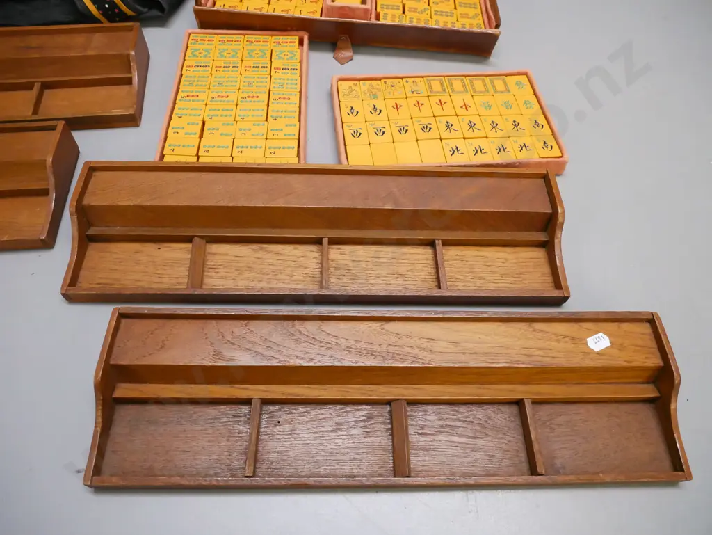 vintage leather-cased Mahjong set with lift-out trays, manufacturer marked on latch and case, plus 4 teak tile trays. Image 1++