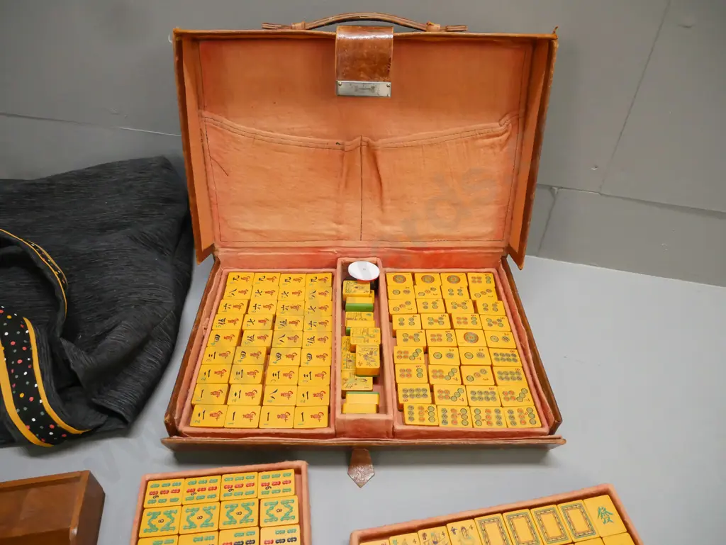 vintage leather-cased Mahjong set with lift-out trays, manufacturer marked on latch and case, plus 4 teak tile trays. Image 1++