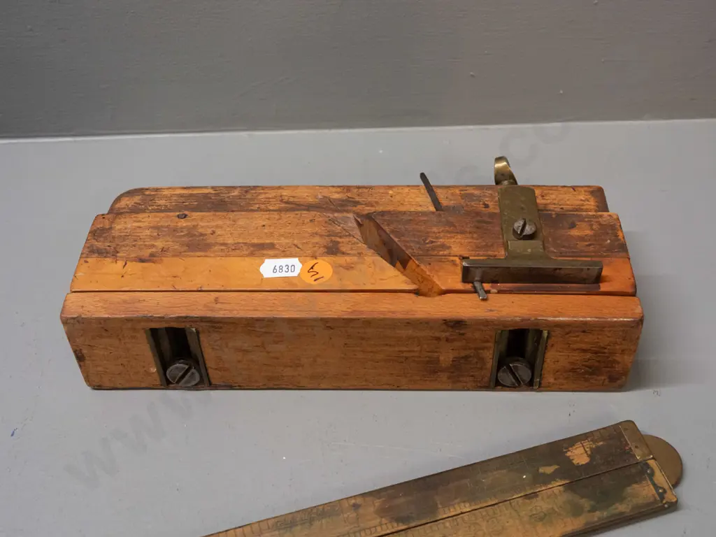 vintage moulding plane marked Griffiths Norwich L-240 and a folding rule with brass fittings - age wear and staining Image 1++