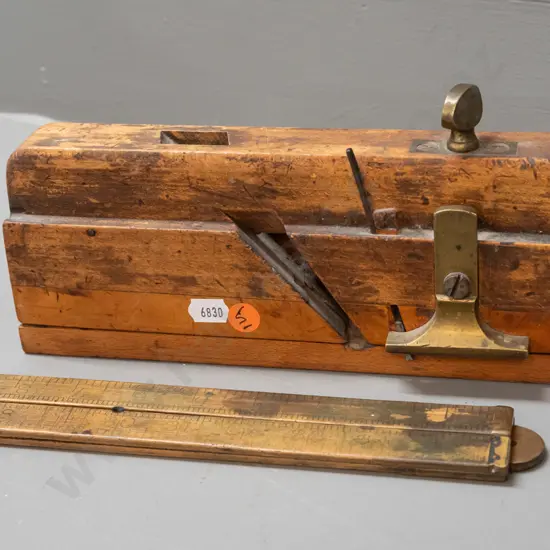 vintage moulding plane marked Griffiths Norwich L-240 and a folding rule with brass fittings - age wear and staining