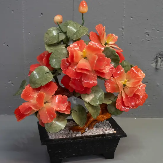 jade tree with pink flowers, carved stone petals and leaves, on ceramic trunk set in stone or composite base. Repaired