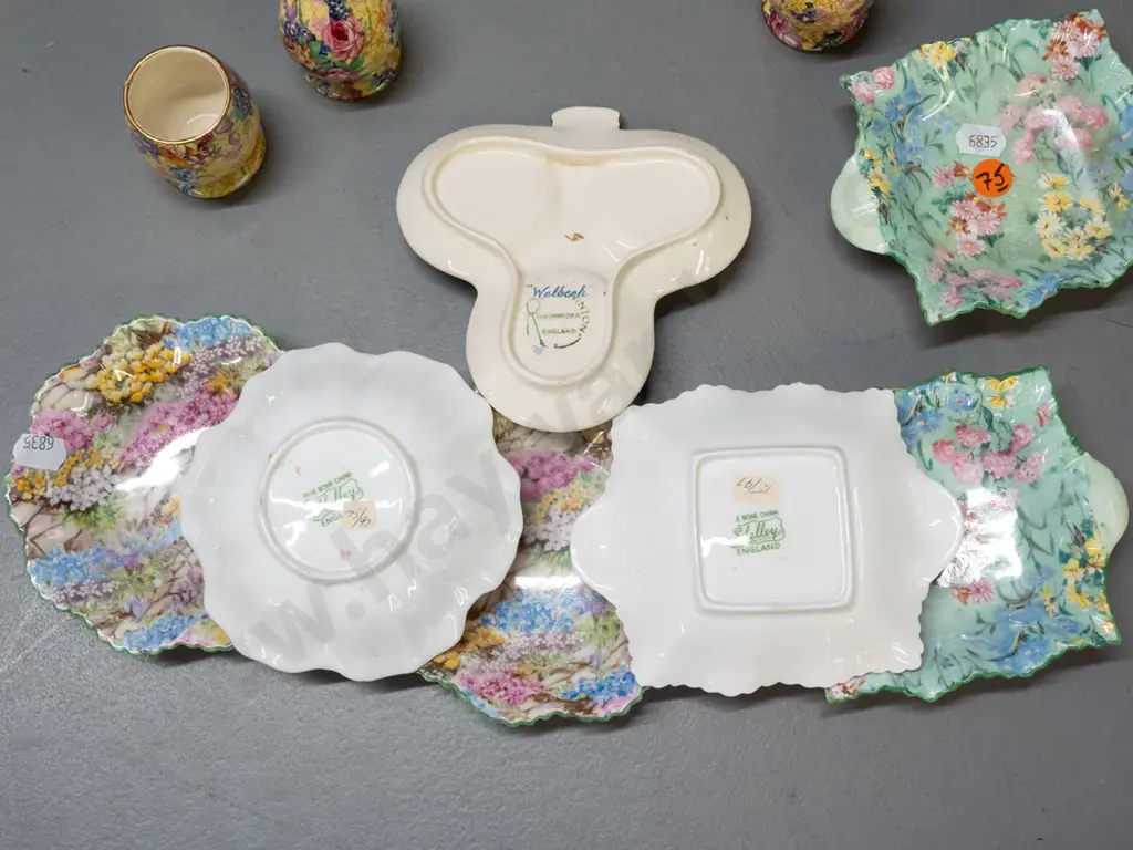 6 small Shelley floral dishes, 4 with hangers on backs & a Royal Winton "Welbeck" clover-leaf shape condiment set Image 1++