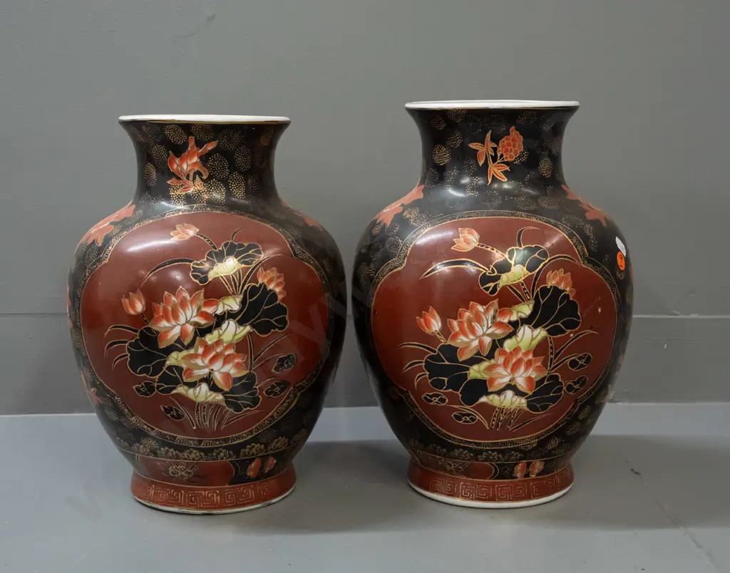 pair of Chinese bolster-shaped vases with floral decoration and gilt highlights - chipping to base of one, some Image 1++